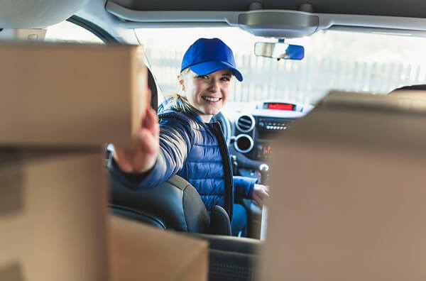 Delivery driver with packages